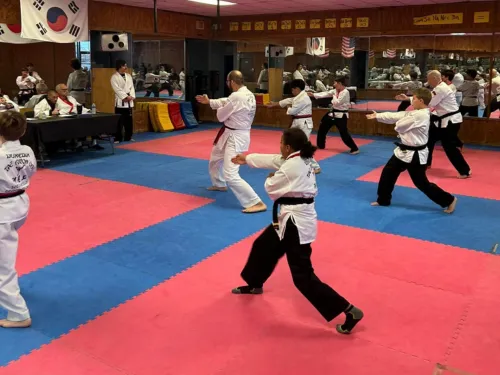 Teen and adult Taekwondo students training at Dunedin Taekwondo Academy