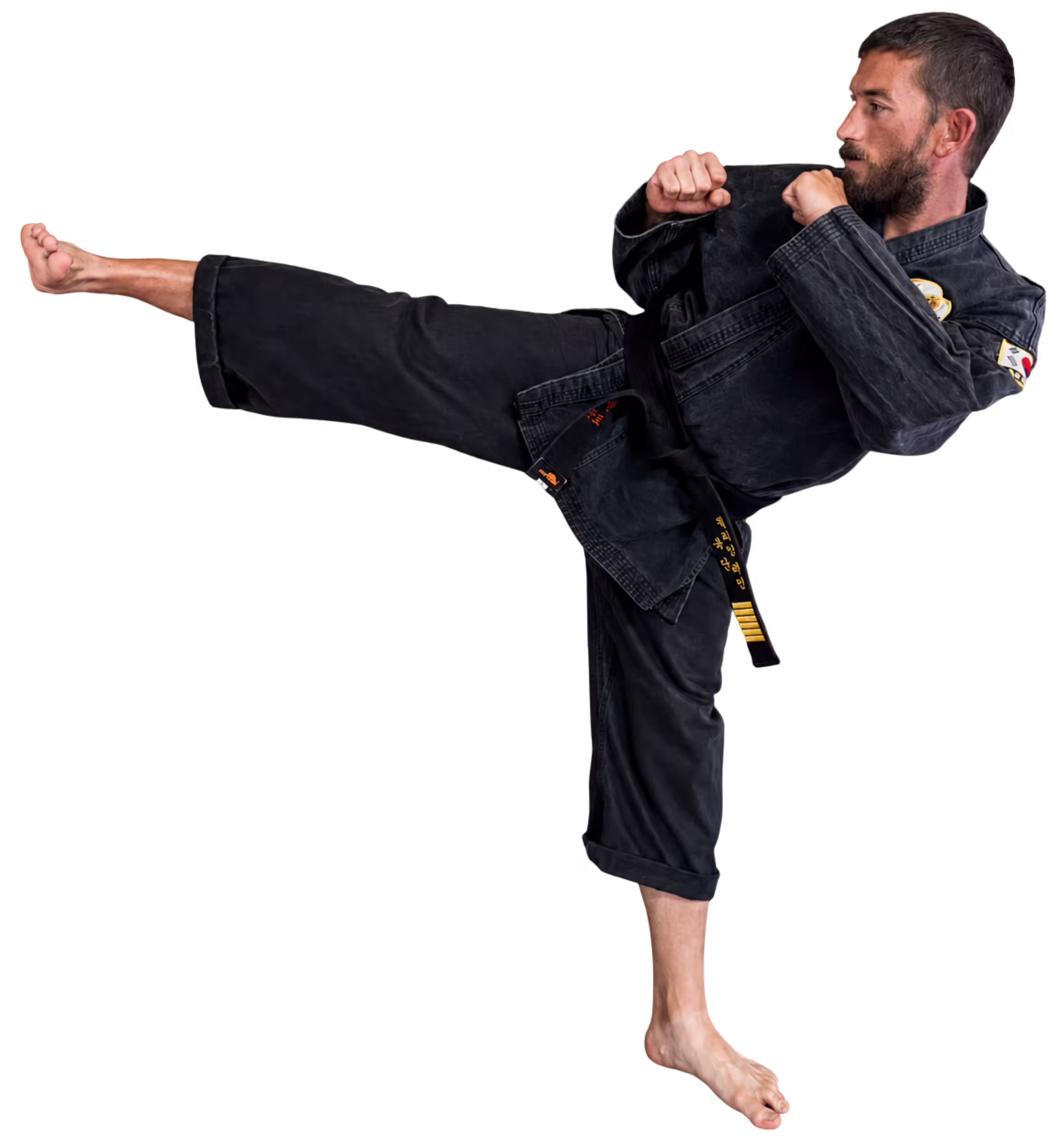 Master BJ Lemminn demonstrating a Taekwondo kick at Dunedin Taekwondo Academy