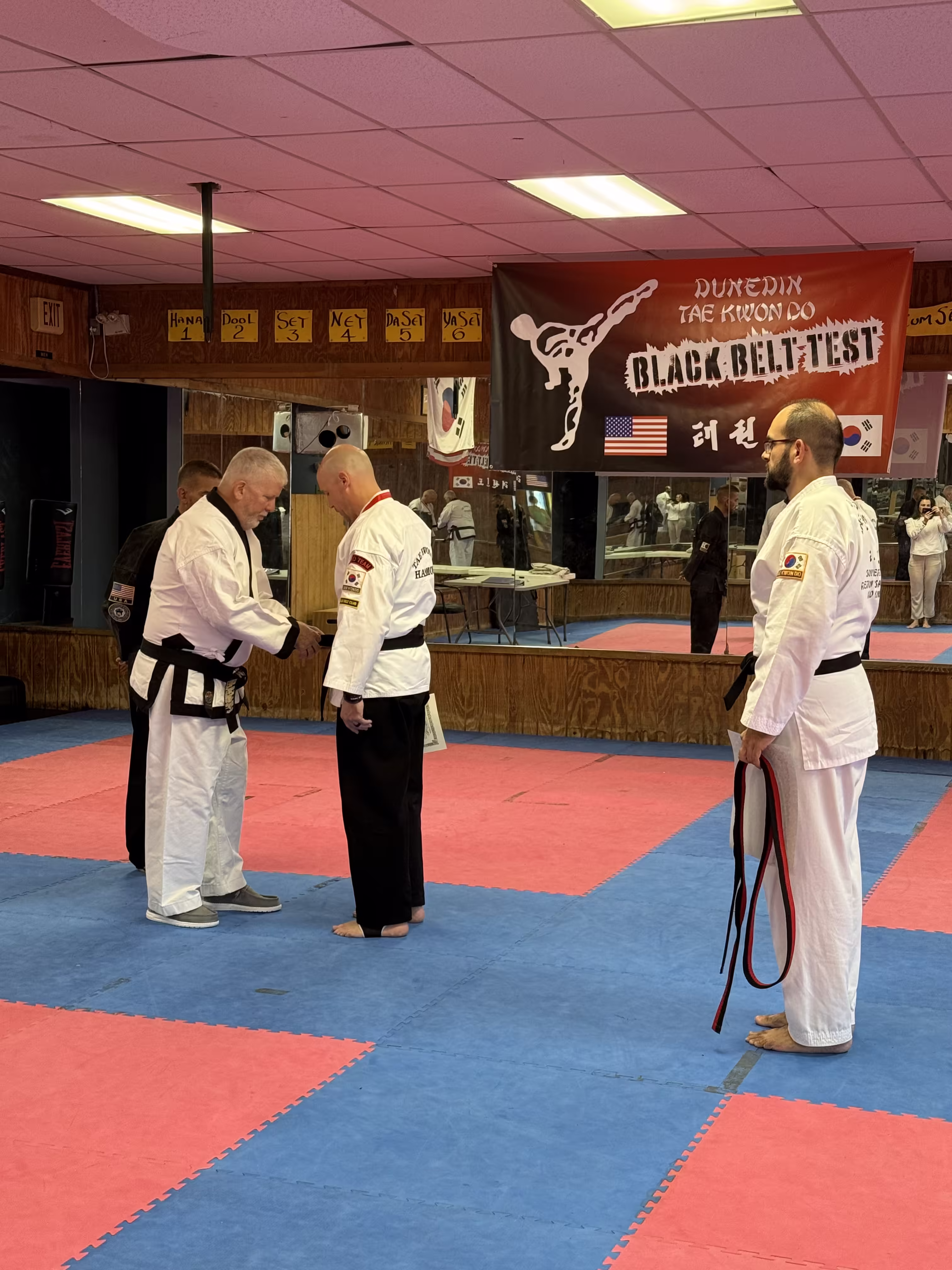 Student earning blackbelt at Dunedin Taekwondo Academy