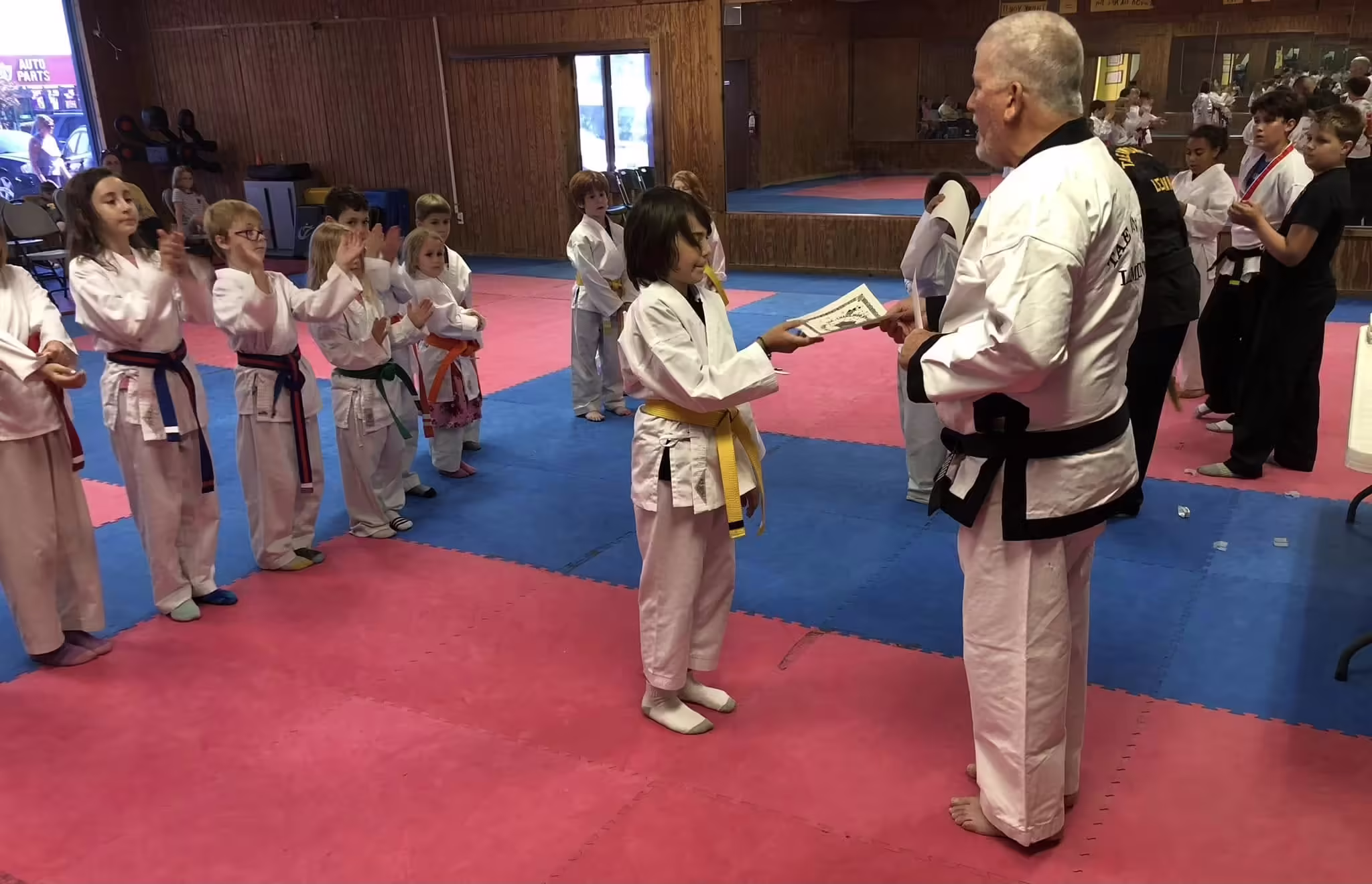 Grand Master Lemminn with young belt testers at Dunedin Taekwondo Academy