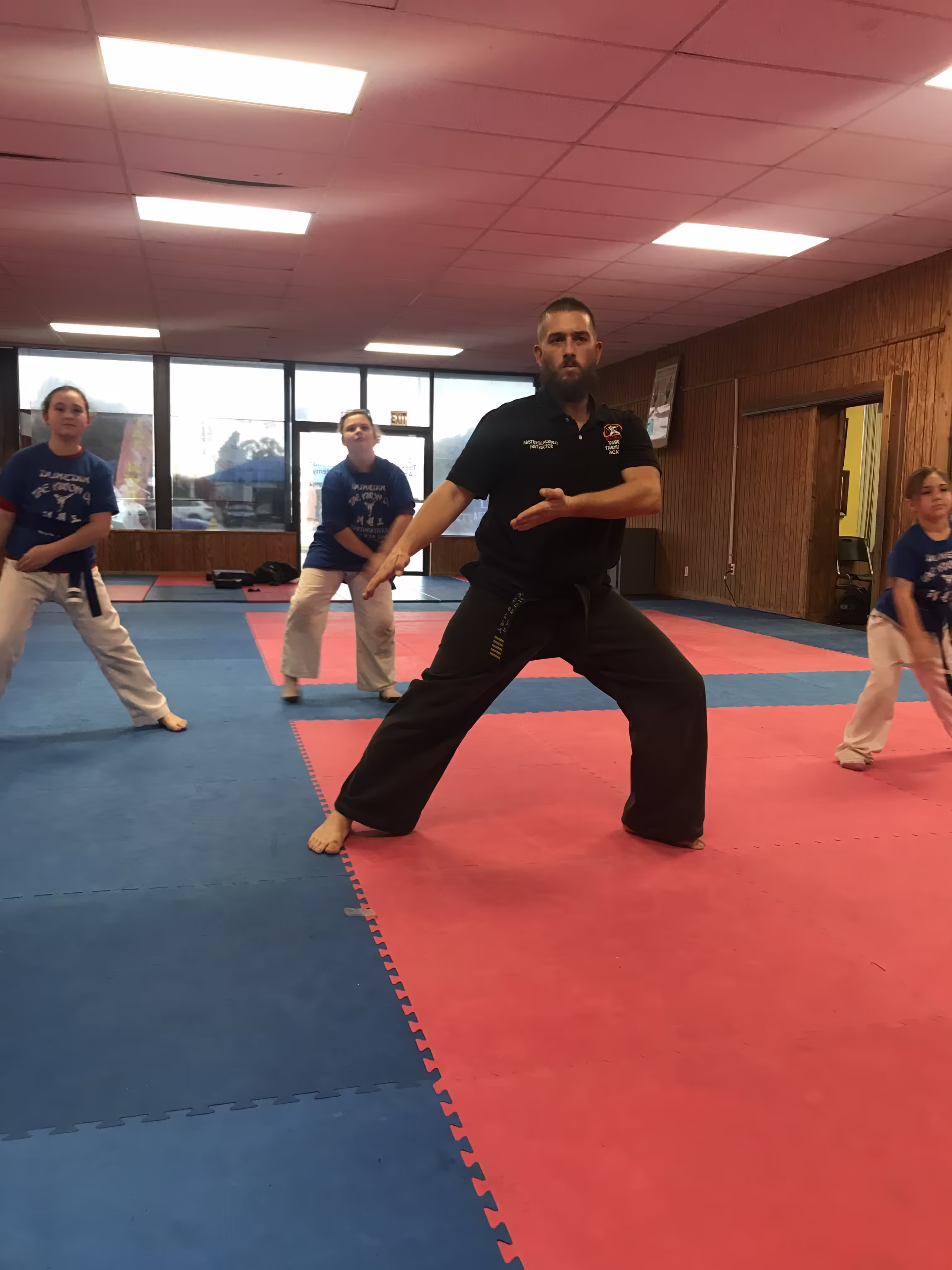 Master BJ Lemminn teaching kids Taekwondo class at Dunedin Taekwondo Academy