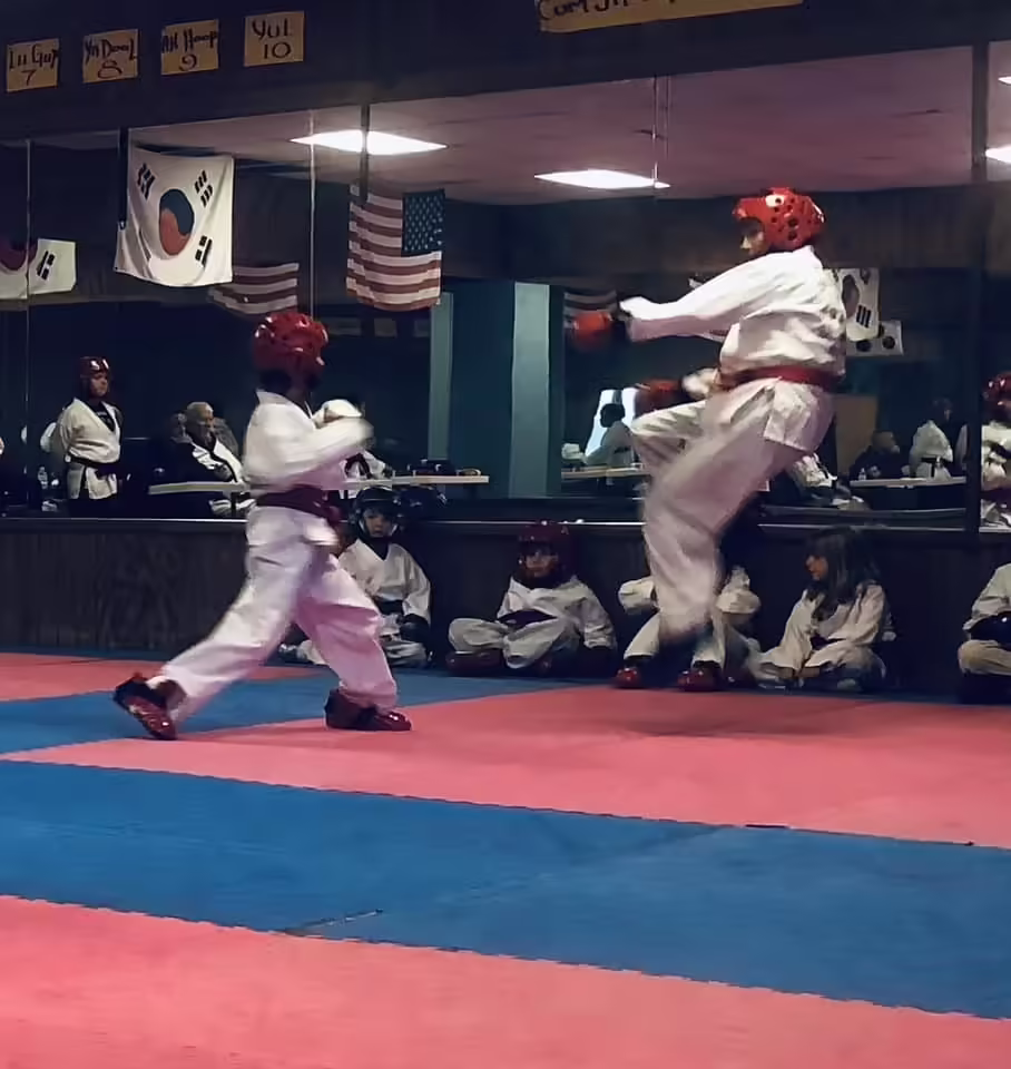 Young Taekwondo students sparring at Dunedin Taekwondo Academy