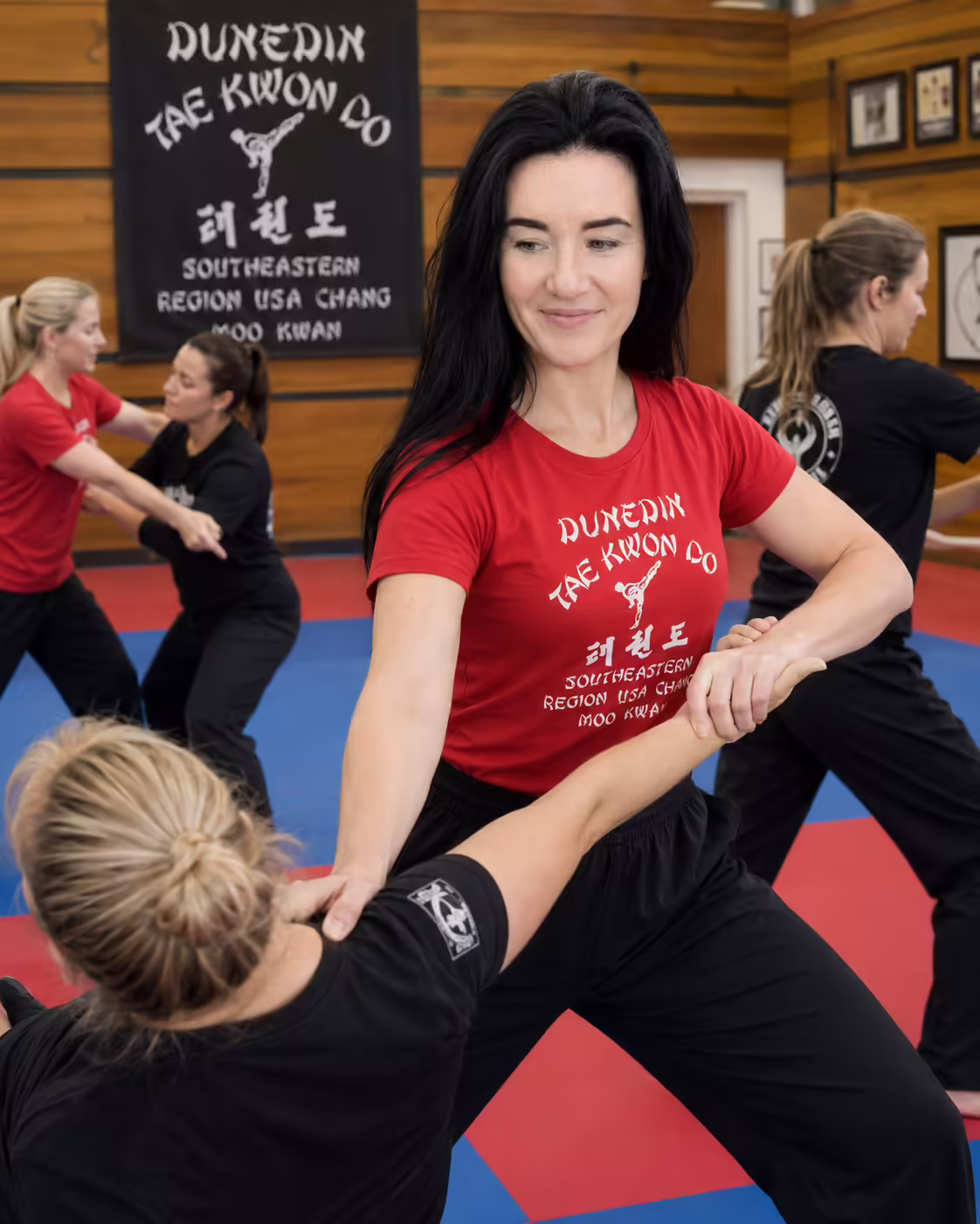 Female student taking a self-defense class at Dunedin Taekwondo Academy